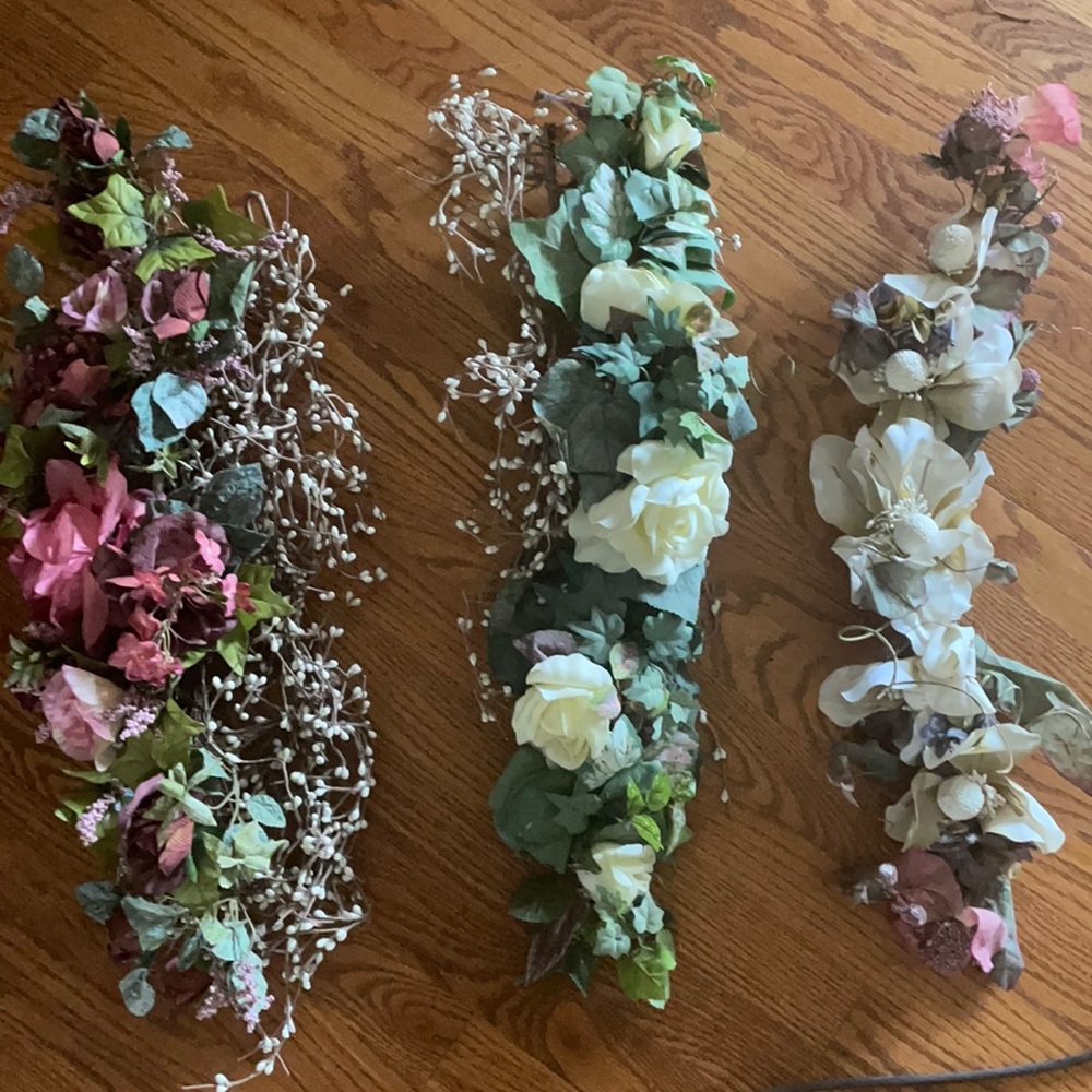 Three floral sprays with two baby breath stands. Good condition